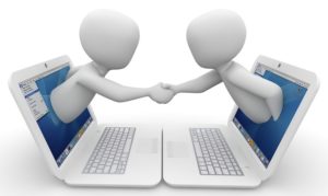 Two Computer People Shaking Hands 880x526